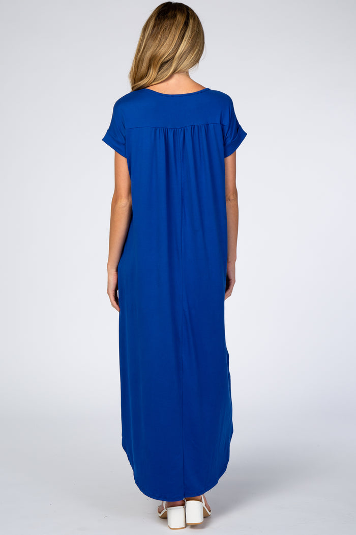 woman wearing a blue maxi maternity dress with short sleeves and a relaxed fit from the back view