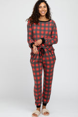 woman wearing a red and black plaid long sleeve pajama set with drawstring pants and relaxed fit