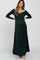woman wearing a dark green off-shoulder maternity dress with long sleeves and a visible baby bump