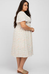 woman wearing a floral plus size midi dress with flutter sleeves and a relaxed fit, standing sideways