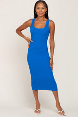 woman wearing a bright blue ribbed midi dress with a scoop neckline and shoulder straps