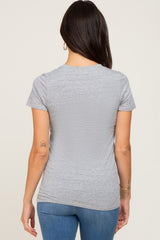 woman wearing a gray short sleeve t-shirt from the back, with a casual fit and soft fabric