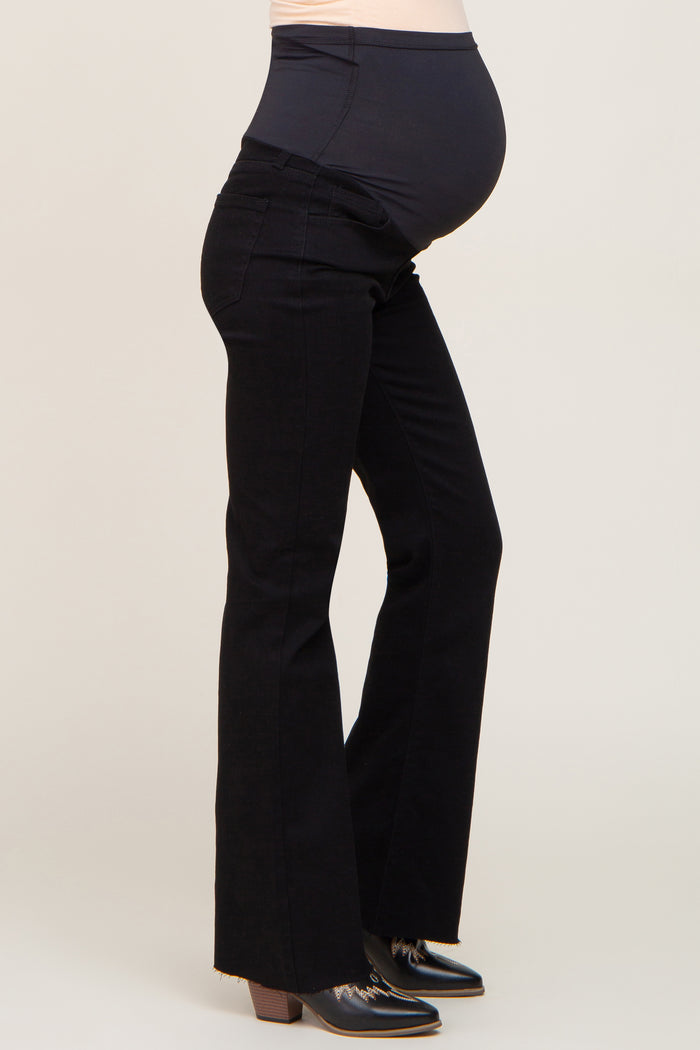 maternity wear black flared jeans with a supportive waistband and visible baby bump