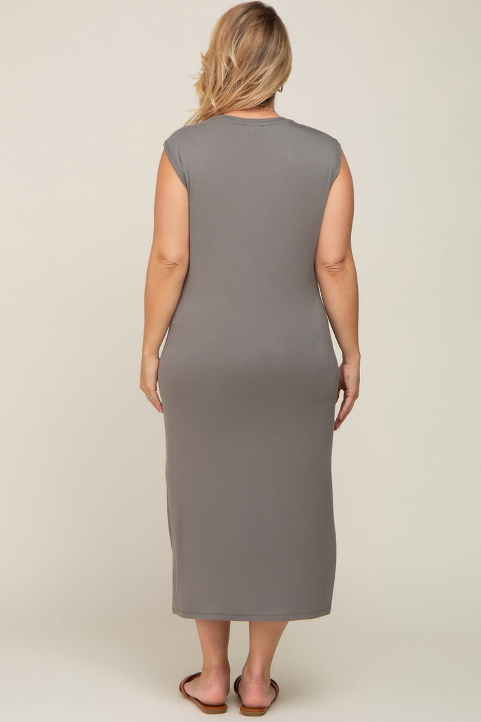 woman wearing a gray sleeveless maternity plus dress, showing the back view and a form-fitting silhouette