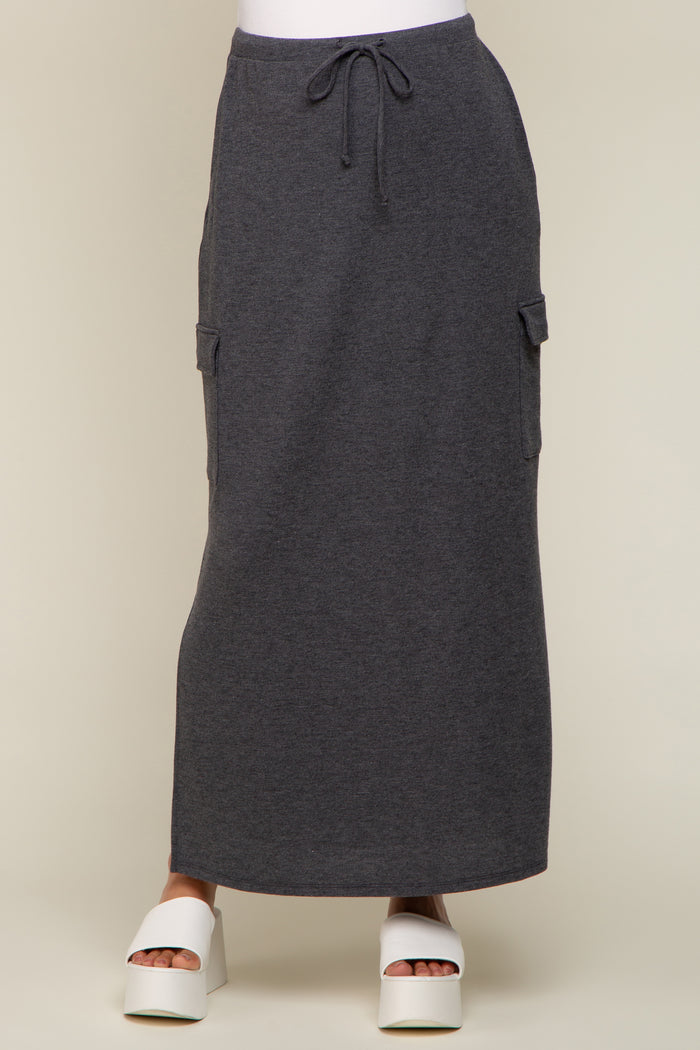 charcoal grey maxi cargo skirt with drawstring waist and side pockets paired with white platform sandals