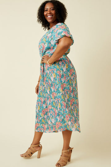 woman wearing a colorful floral plus size midi dress with short sleeves and a cinched waist, paired with strappy heels