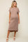 woman wearing a taupe ribbed maternity dress with short sleeves and a side slit, showcasing her baby bump