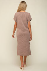 woman wearing a brown and white striped maternity dress with short sleeves and a mid-length silhouette, shown from the back