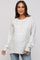 woman wearing a light grey speckled maternity sweater with a relaxed fit and long sleeves, showing her baby bump