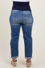 woman wearing light blue maternity plus distressed boyfriend jeans from the back, showing a comfortable elastic waistband