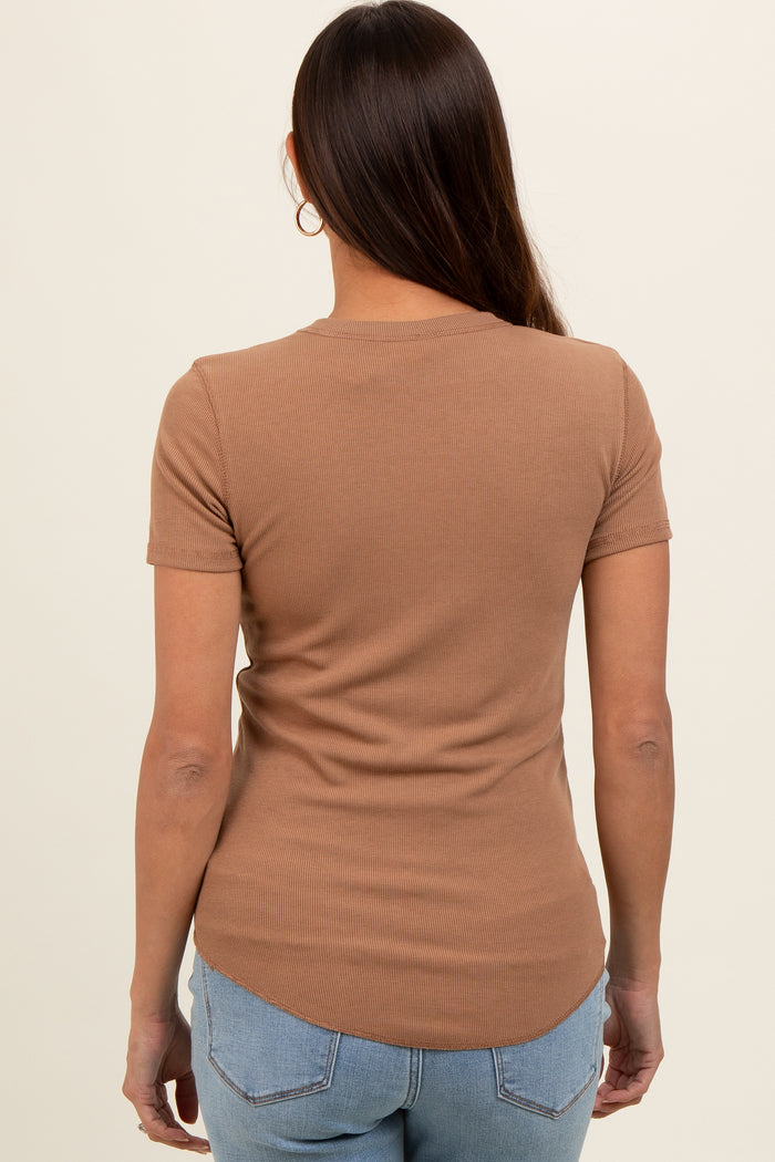 woman wearing a brown short sleeve fitted maternity top, showing the back view with a curved hem