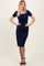 woman wearing a navy blue midi dress with short sleeves and a tie waist detail
