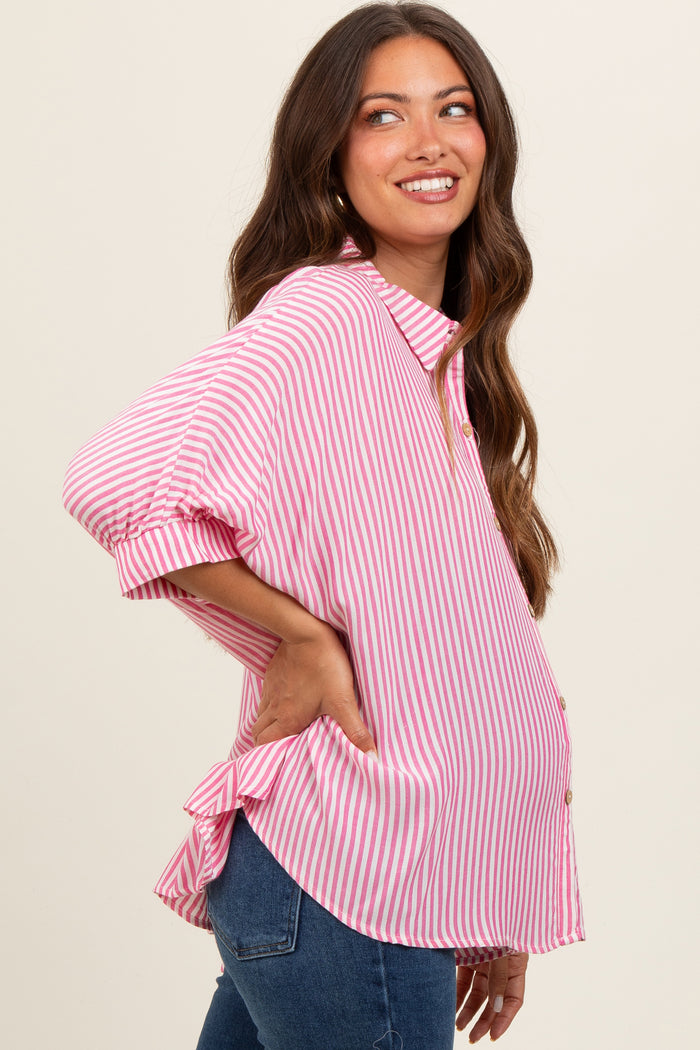 woman wearing a pink and white striped maternity shirt with short puff sleeves and a visible baby bump