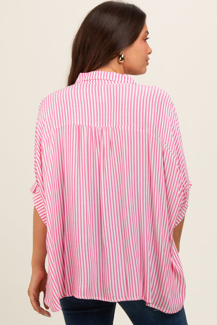 woman wearing a pink and white striped maternity blouse with a relaxed fit and cuffed sleeves, showing her back